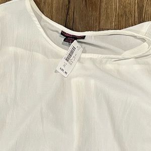 NWT RocknRoll Cowgirl white sleeveless top. Fake front knot and longer in back.